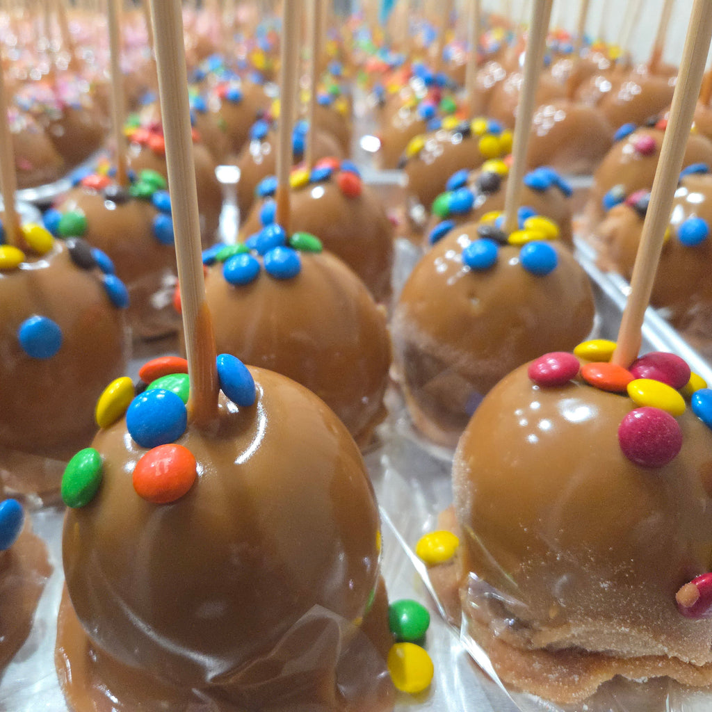 Traditional Caramel Apple covered in colorful M&M's