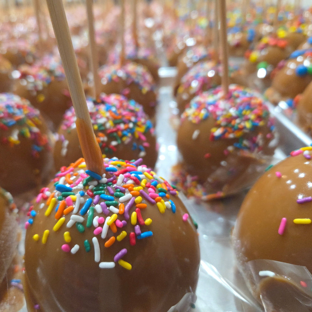 Traditional Caramel Apple covered in colorful sprinkles