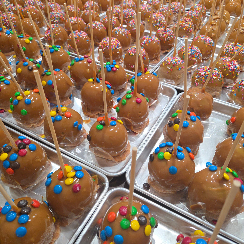 Traditional Caramel Apple covered in colorful sprinkles