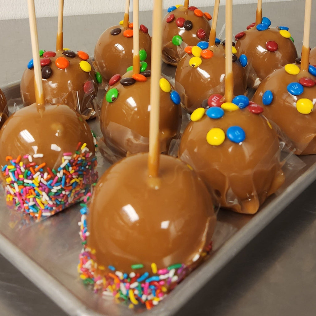 Traditional Caramel Apple covered in colorful sprinkles
